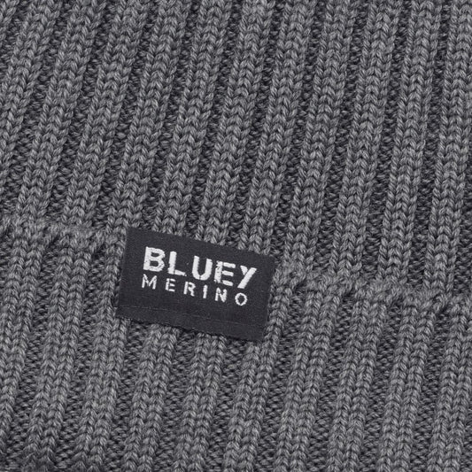 Up close Fisherman knit grey Merino beanie with a brand label © Bluey Merino Tasmania
