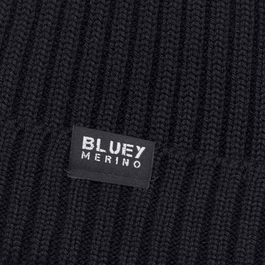 Up close - Fisherman knit Merino Black beanie with a brand label © Bluey Merino Tasmania