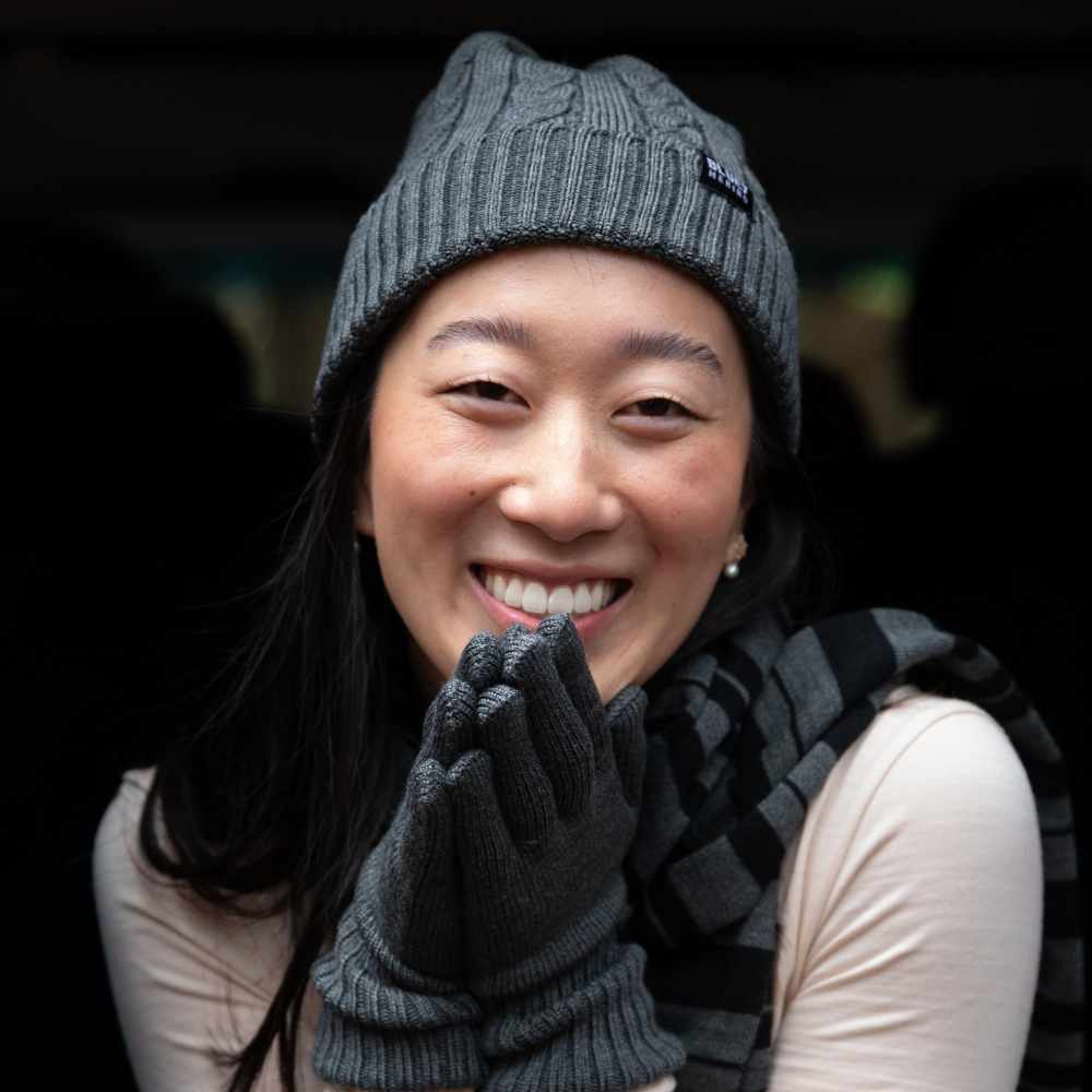 woman wearing a merino beanie, gloves and scraf, happy © Bluey Merino Tasmania