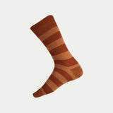 Terracotta and Brown striped sock with Humphrey Law branding on a white background - Ghost.