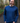Men's Tasmanian Merino 180 Orson Long Sleeve Crew Neck Top . The top has wrist cuffs and a fine stitching line across the top shoulders. The crew neck line is classic and hugs the neck nicely - Steve is smiling and is  relaxed with his hands in his jeans pockets. He is standing in the middle of Hollybank reserve (Tasmania) amongst trees. Photography by Melanie Kate Creative -  © Bluey Merino