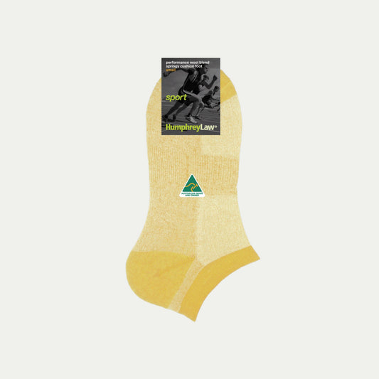 Yellow sock with a brand label on a light gray background