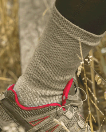Close-up of a foot wearing a 61C_Antelope_Breathable Merino Hiking Sock in a hiking shoe in a natural setting © Humphrey Law
