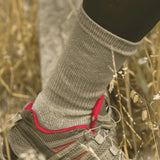 Close-up of a foot wearing a 61C_Antelope_Breathable Merino Hiking Sock in a hiking shoe in a natural setting © Humphrey Law