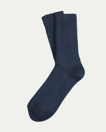 Luxurious, comfy Tasmanian Merino Base socks displayed flat lay on a white background, highlighting their soft texture and premium quality. © Bluey Merino Tasmania