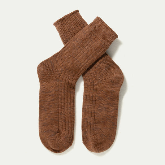 A pair of Merino ribbed knit crew socks in a warm brown colour, arranged in a crossed layout on a clean off-white background. © Bluey Merino Tasmania