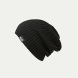 Fisherman knit Merino Black beanie with a brand label on a light grey background - beanie slouchy style © Bluey Merino Tasmania