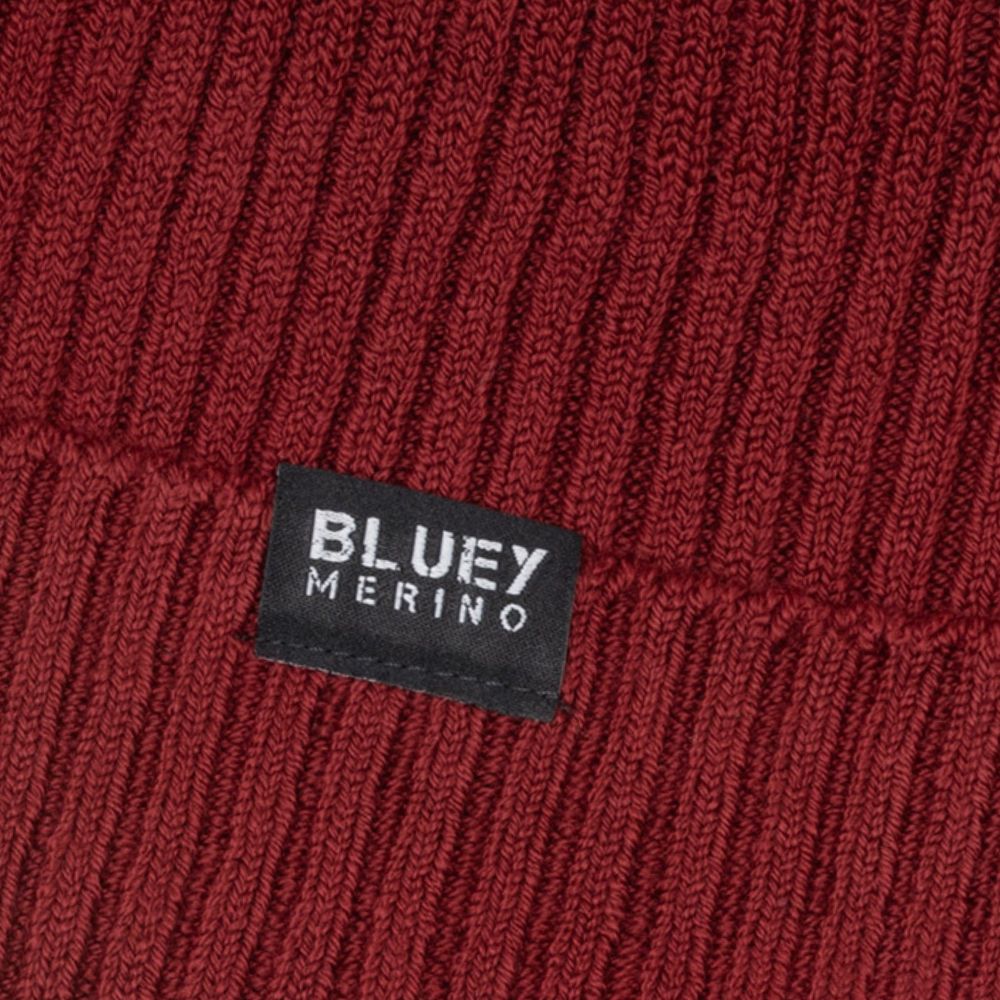 Up close - Fisherman knit burgundy Merino beanie with a brand logo © Bluey merino Tasmania