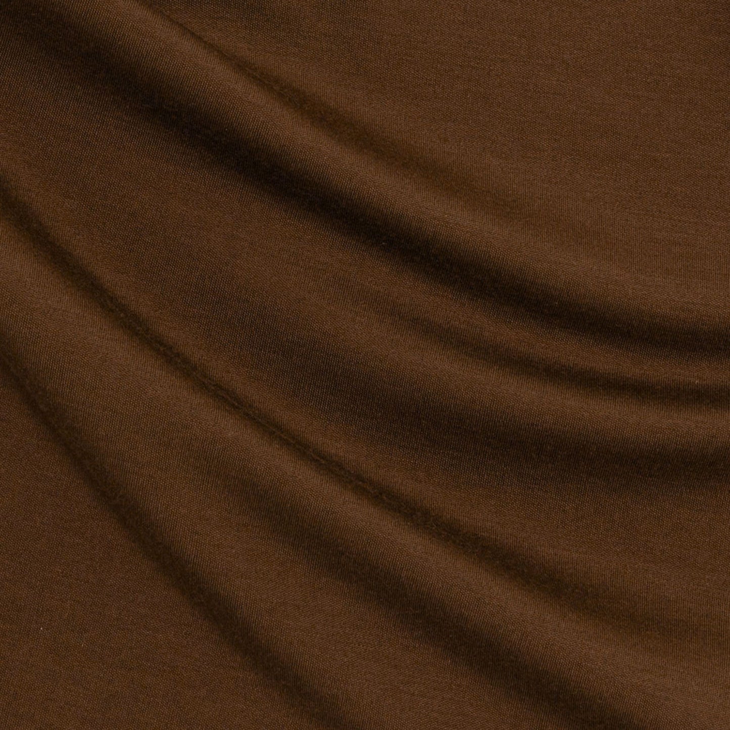 Chestnut Brown Material - up close. Merino Chestnut Brown long-sleeve henley shirt on a light grey background © Bluey Merino Tasmania