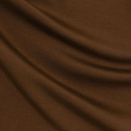 Chestnut Brown Material - up close. Merino Chestnut Brown long-sleeve henley shirt on a light grey background © Bluey Merino Tasmania