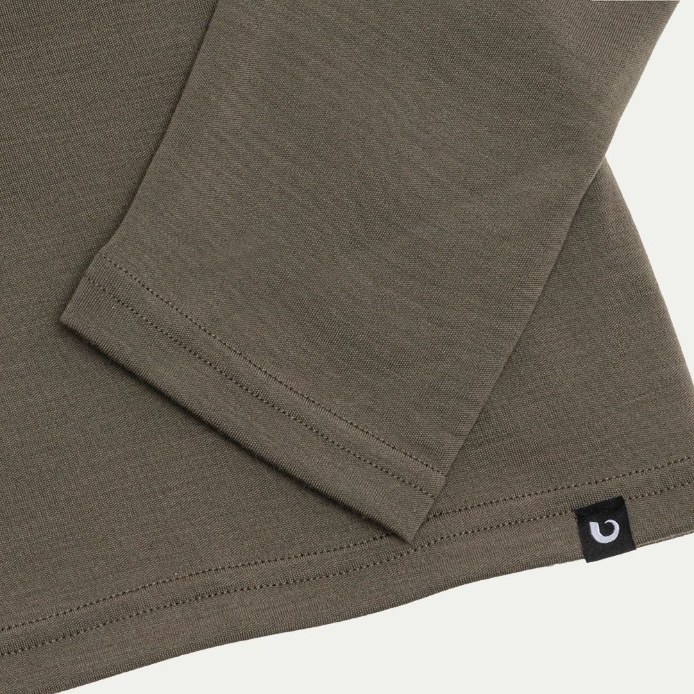 Sage green fabric with a visible brand logo on a white background