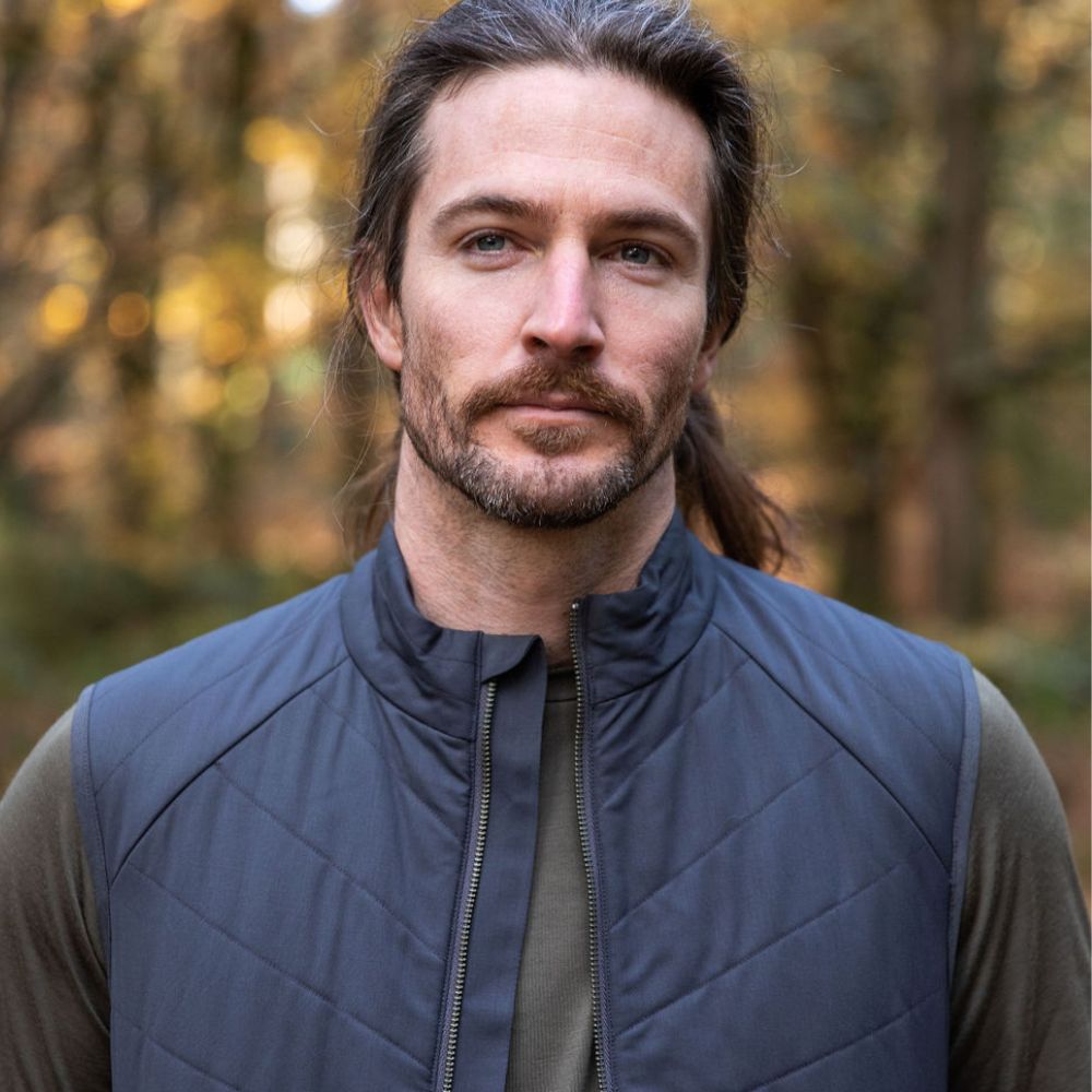 Man wearing a Merino quilted gilet vest in northern Tasmanian wilderness © Bluey Merino Tasmania