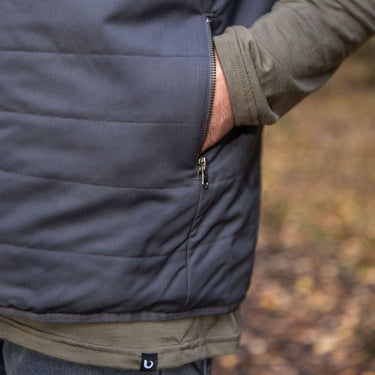 Up close pocket - Man wearing a Merino quilted gilet vest in northern Tasmanian wilderness © Bluey Merino Tasmania