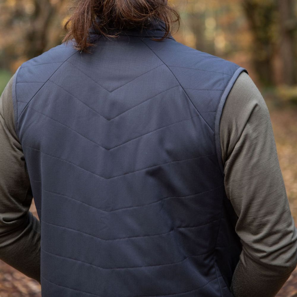 Man wearing a Merino quilted gilet vest in northern Tasmanian wilderness © Bluey Merino Tasmania