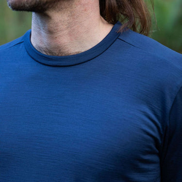 Person wearing a Merino blue shirt with a blurred background © Bluey Merino Tasmania