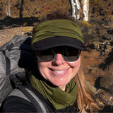 Julia is wearing Bluey Merino's short neck warmer around her head to protect her ears from the wind and keep her hat in place. She is also wearing the long Merino neck warmer around her neck © Julia Patten