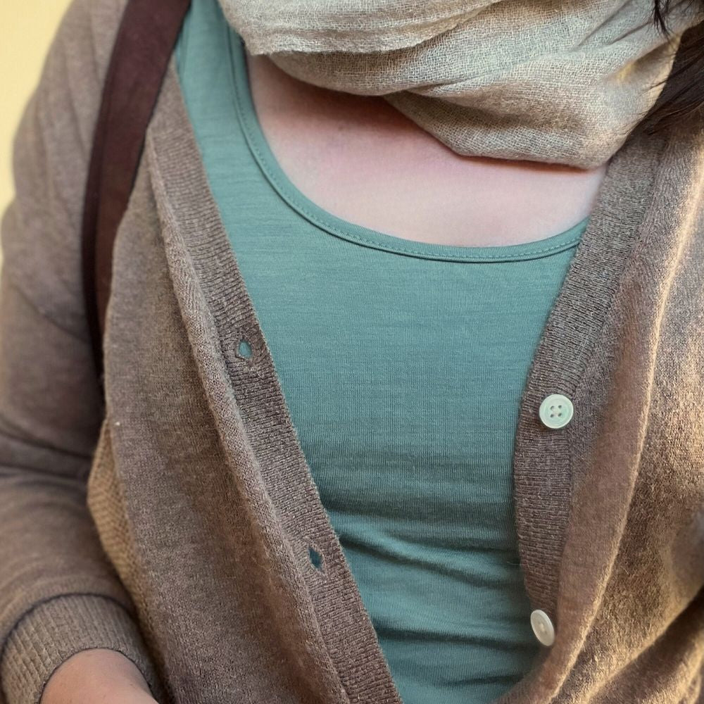 Merino tank top in the colour Oyster Bay (Duck Egg Blue) up close, worn with a scarf - travel outfit © Bluey Merino Tasmania