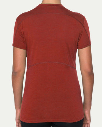 Red t-shirt worn by a person on a white background