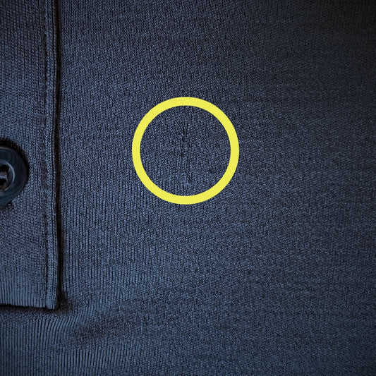 Factory second - Men's Merino Henley -Tasman blue fabric defect close up with a yellow circle. © Bluey Merino Tasmania