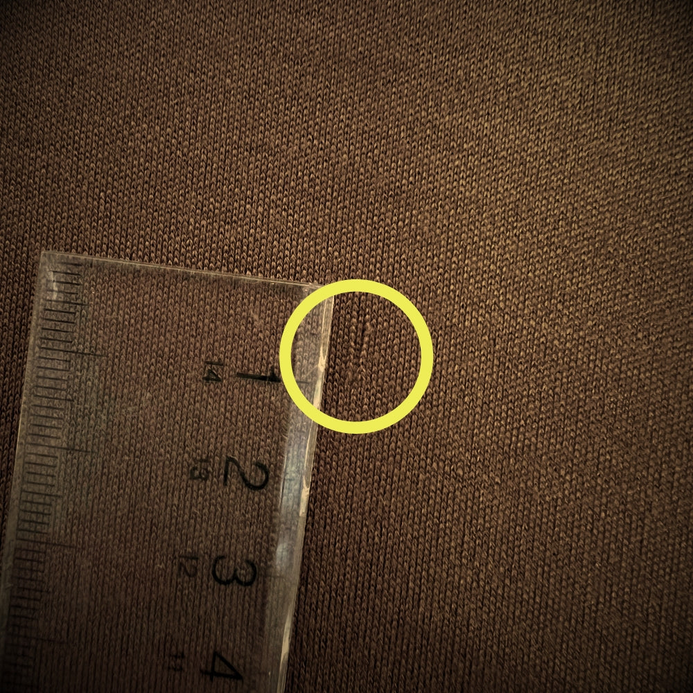Close up detail to fabric defect - factory second Men's Henley in Chestnut © Bluey Merino Tasmania.